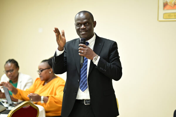Attendees engaging with a speaker at the Echo Lumena Regional Refresher Training, Hotel Africana, Kampala, June 2026